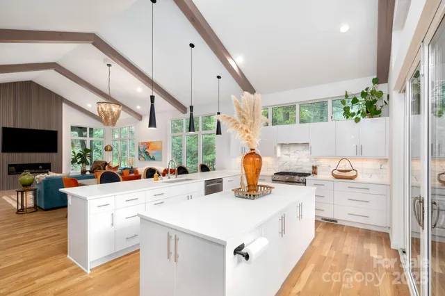 a kitchen with sink a stove and cabinets