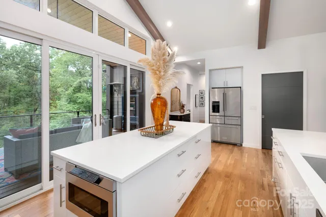a kitchen with a stove a refrigerator and a stove