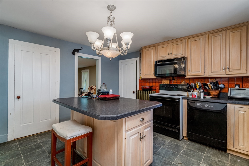 16 Maple Street Sterling, MA 01564 - Photo 14 of 42 a kitchen with stainless steel appliances a sink stove and refrigerator