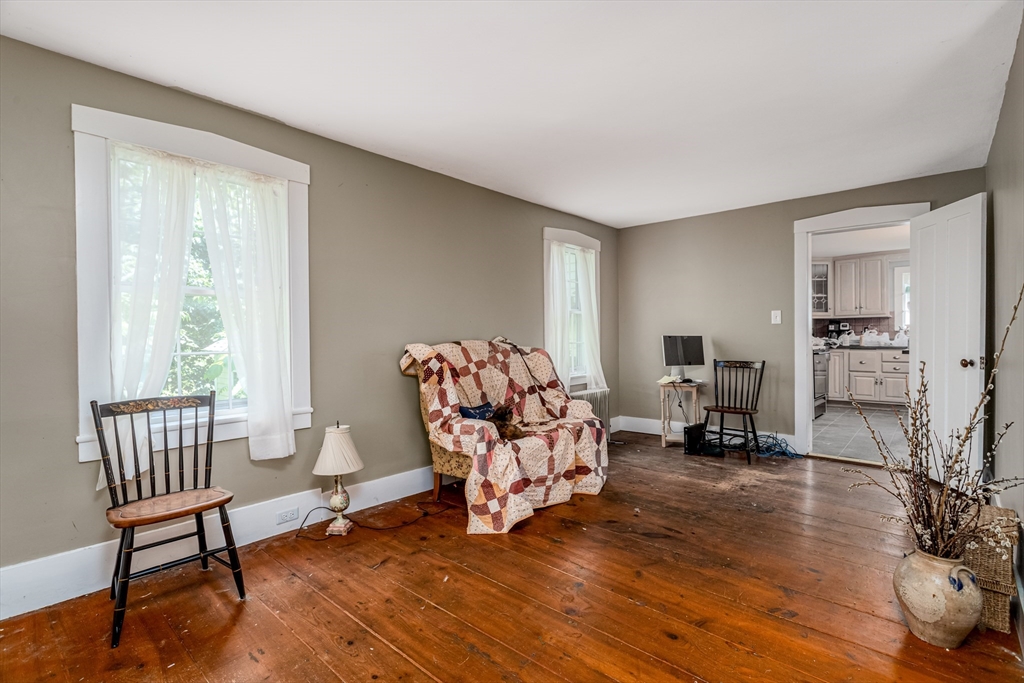 16 Maple Street Sterling, MA 01564 - Photo 24 of 42 a living room with furniture and a wooden floor