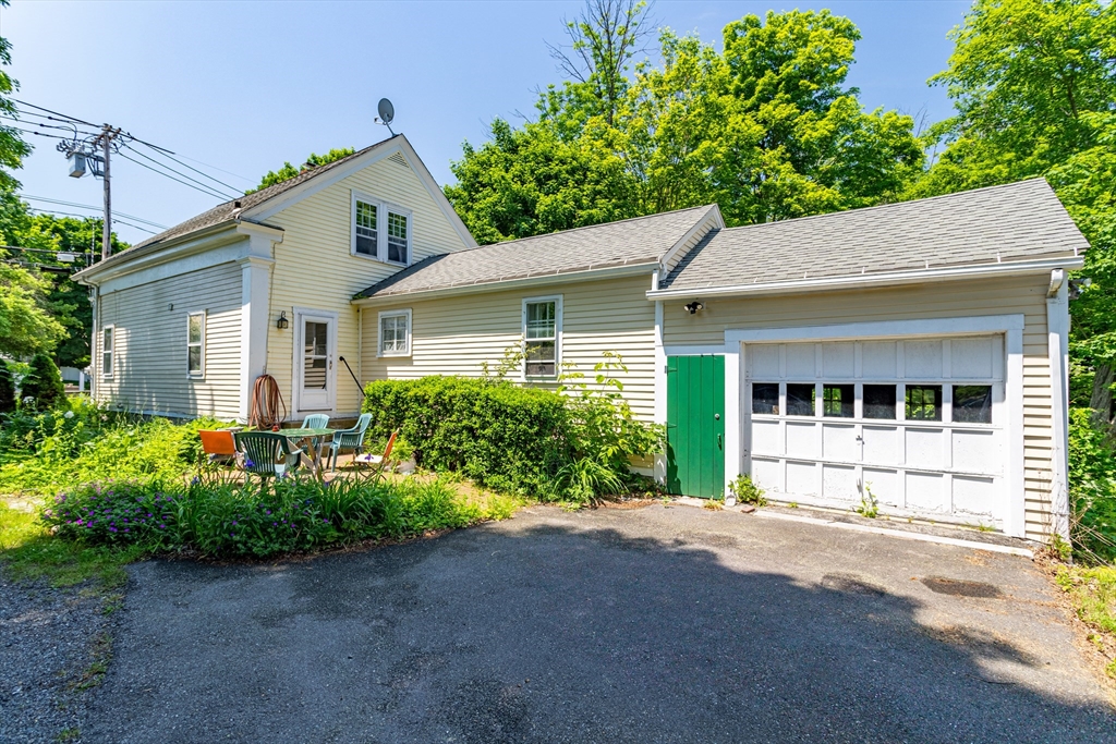 16 Maple Street Sterling, MA 01564 - Photo 37 of 42 a front view of a house with garden