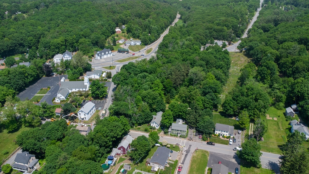 16 Maple Street Sterling, MA 01564 - Photo 38 of 42 an aerial view of residential house with outdoor space and trees all around