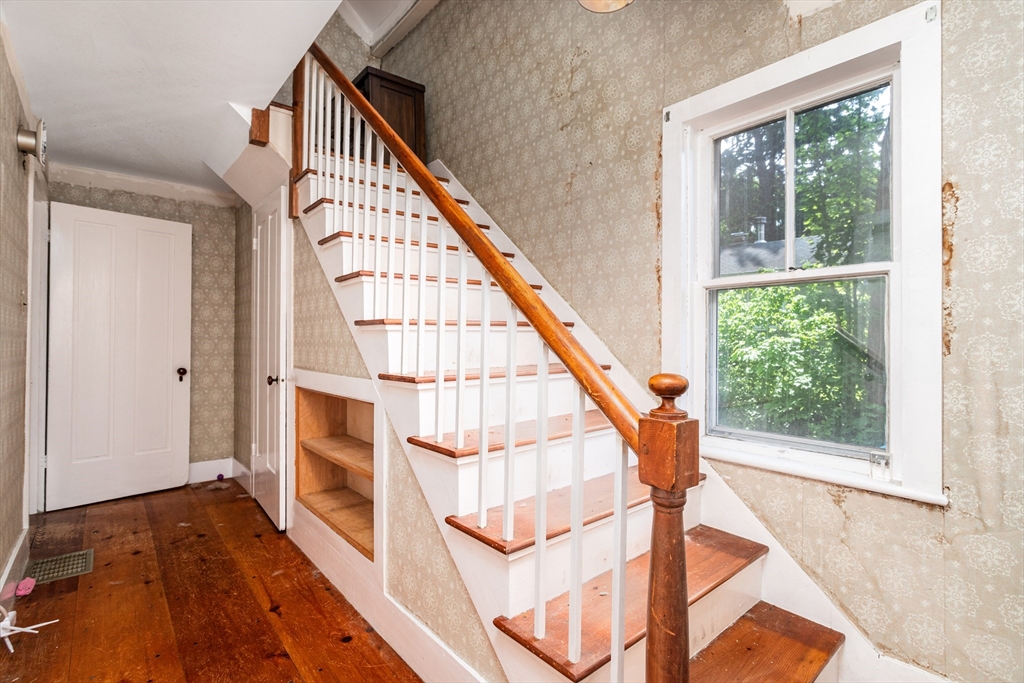 16 Maple Street Sterling, MA 01564 - Photo 4 of 42 a view of an entryway with wooden floor and door