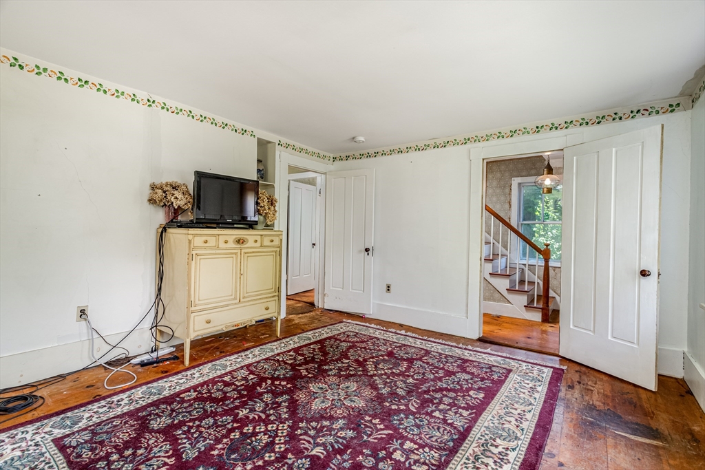 16 Maple Street Sterling, MA 01564 - Photo 8 of 42 a living room with furniture and a rug