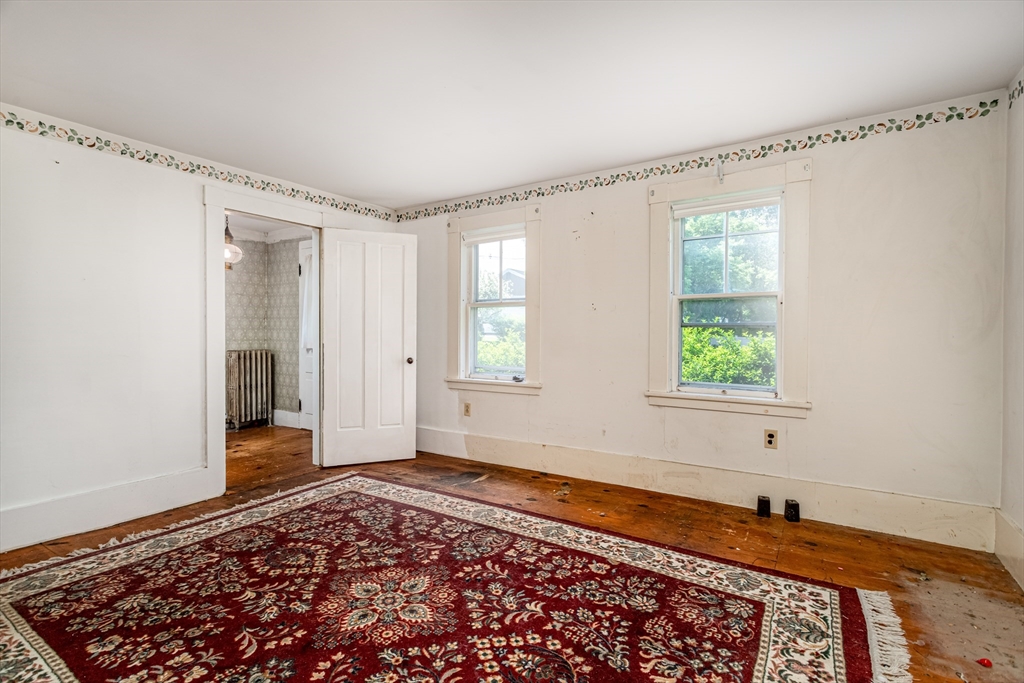 16 Maple Street Sterling, MA 01564 - Photo 9 of 42 a bedroom with a bed and a window