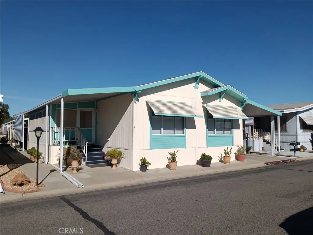 5001 Florida, Unit 311 Hemet, CA 92545 - Photo 1 of 1 a view of a building with car parked