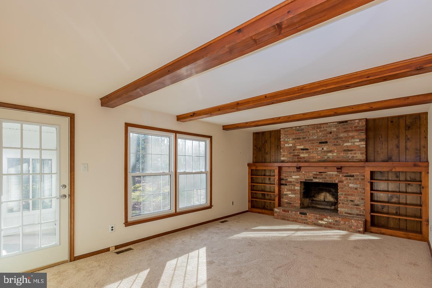 1 Great Bridge Court Medford, NJ 08055 - Photo 15 of 42 Shelving flanks the brick fireplace