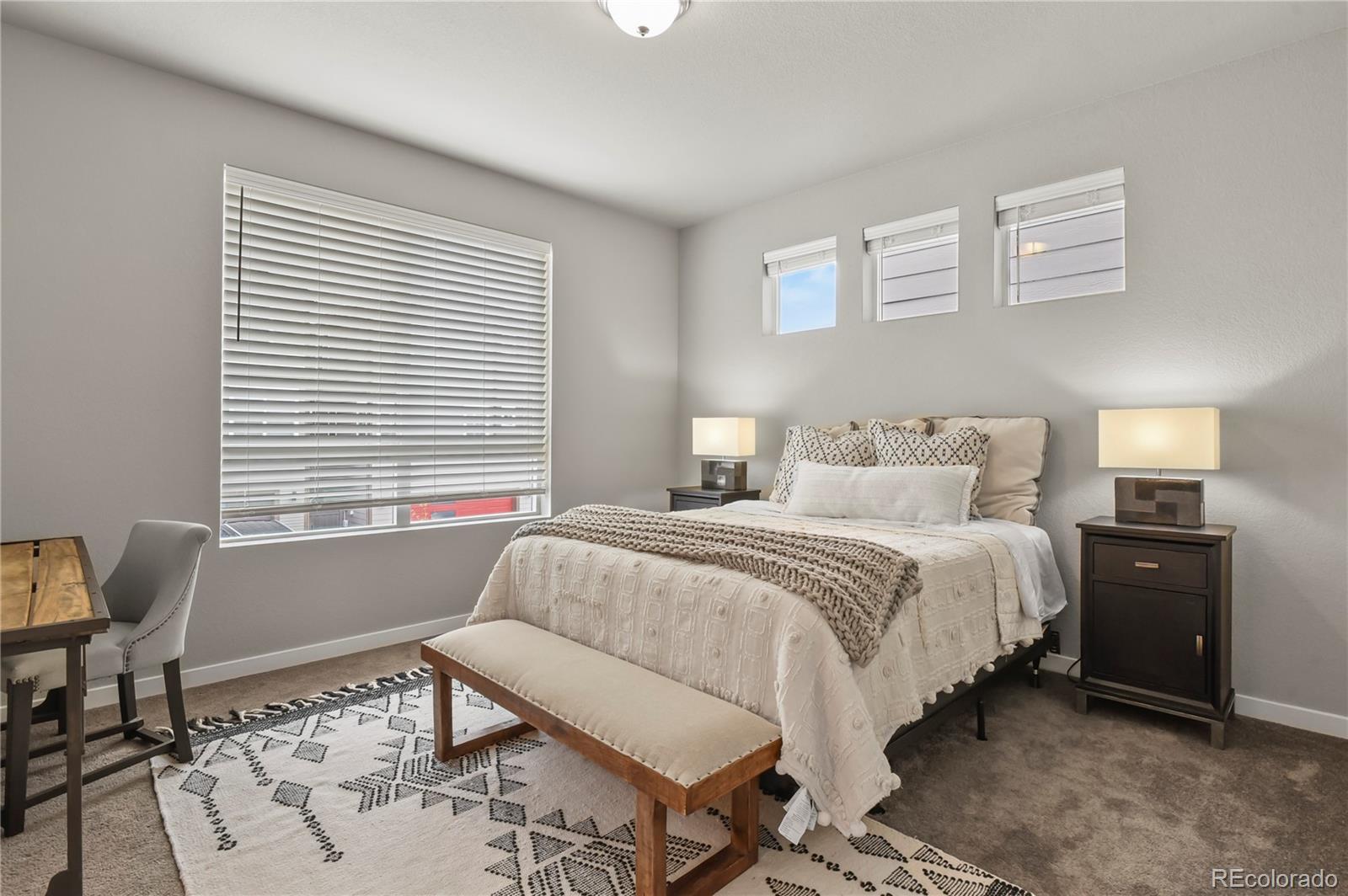 1344 Sunshine Valley Way Colorado Springs, CO 80921 - Photo 18 of 37 a bedroom with a bed and wooden floor