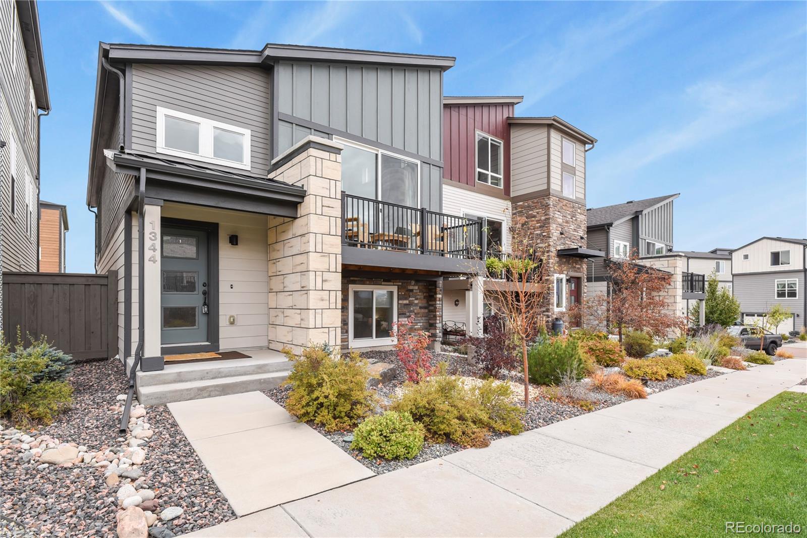 1344 Sunshine Valley Way Colorado Springs, CO 80921 - Photo 2 of 37 a front view of a house with a garden