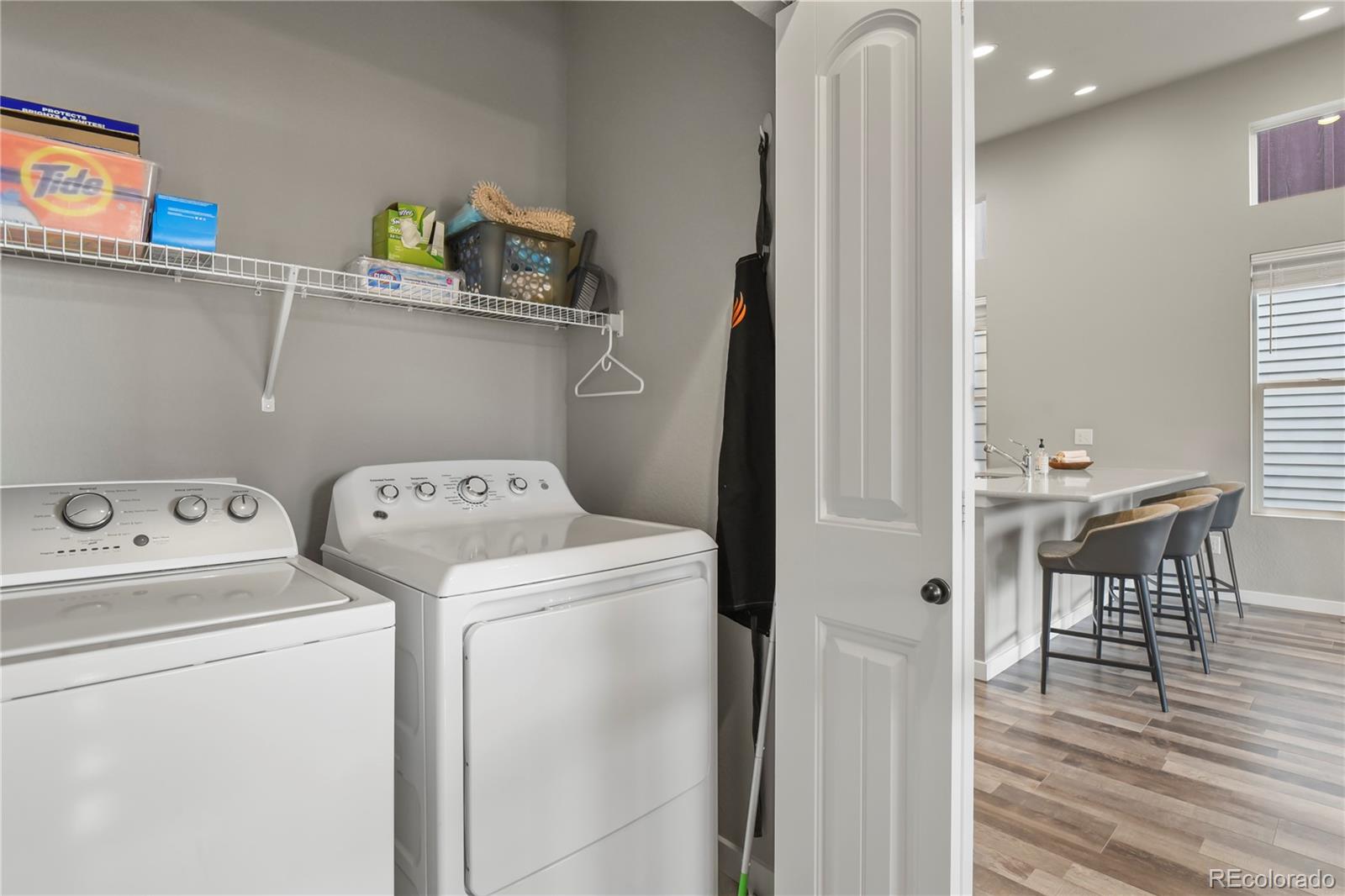 1344 Sunshine Valley Way Colorado Springs, CO 80921 - Photo 25 of 37 a view of storage and utility room with washer and dryer
