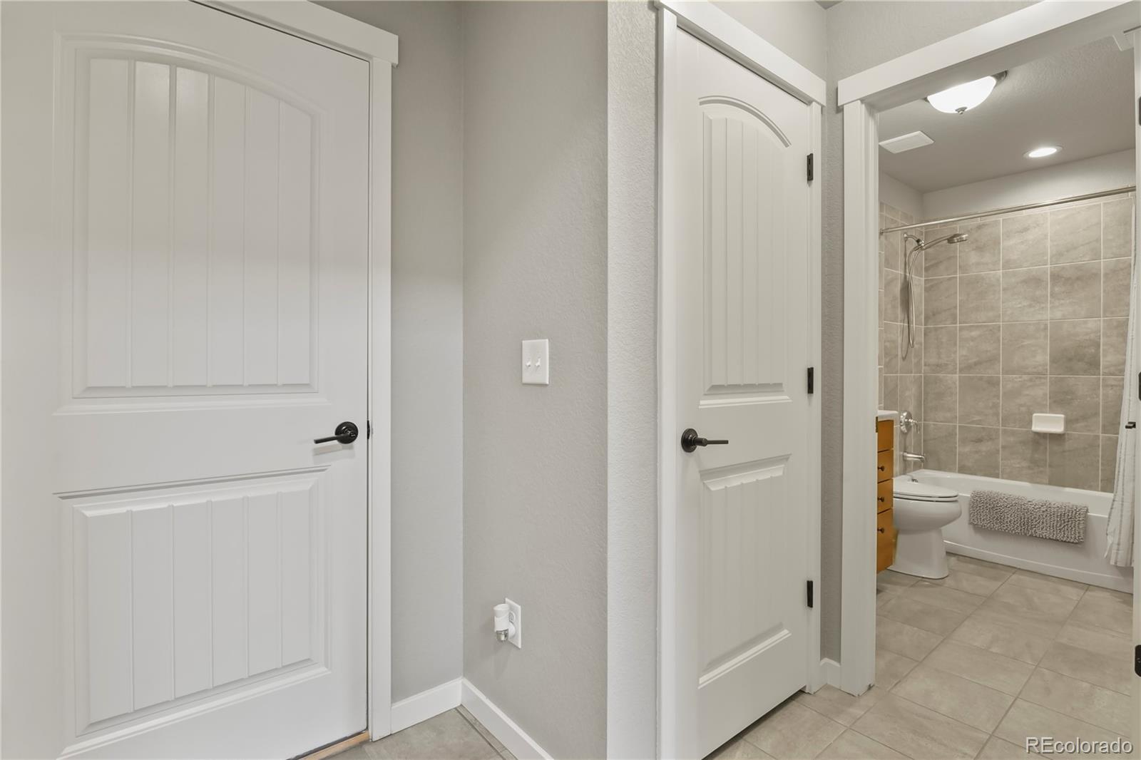 1344 Sunshine Valley Way Colorado Springs, CO 80921 - Photo 27 of 37 a bathroom with a shower and a toilet