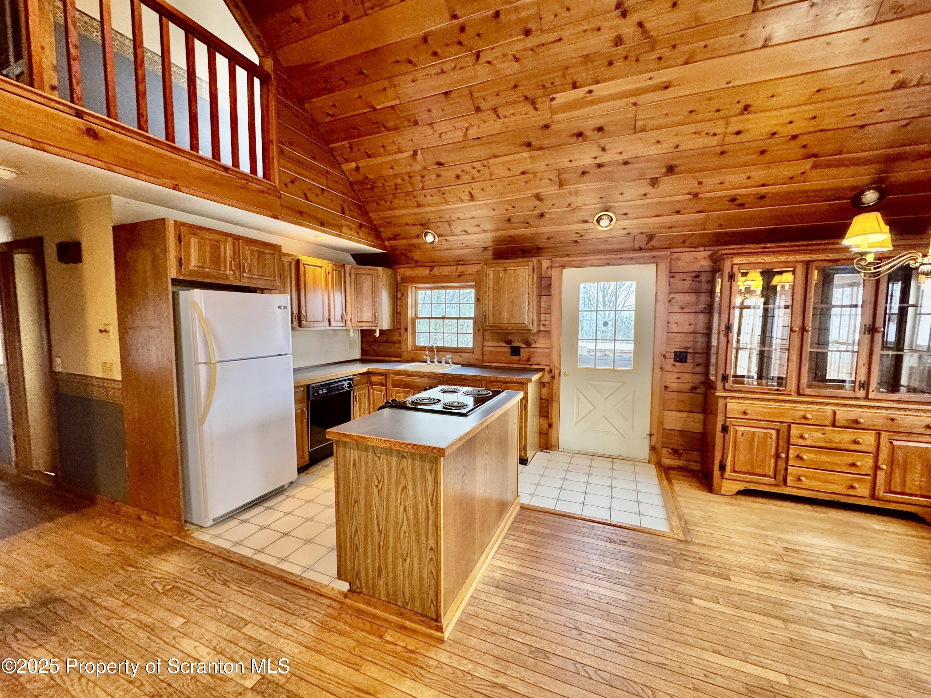 2607 Ransom Road Clarks Summit, PA 18411 - Photo 12 of 46 a kitchen with stainless steel appliances granite countertop a refrigerator a stove and a wooden cabinets