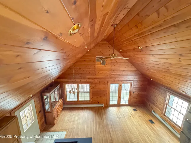 a view of an entryway with wooden floor