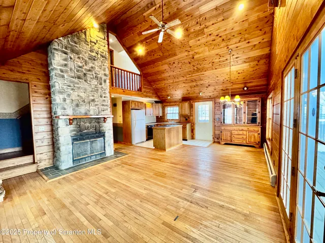 a view of kitchen with furniture and wooden floor