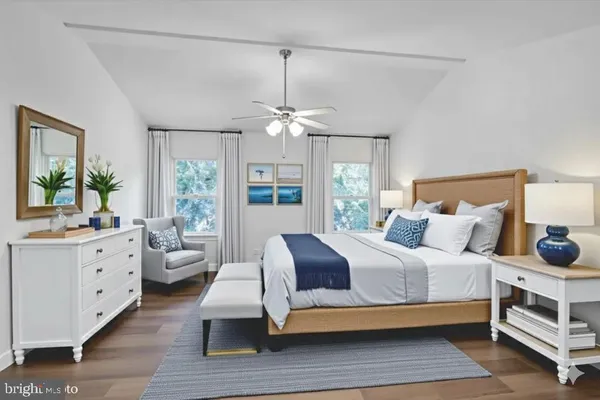 a bedroom with furniture and windows