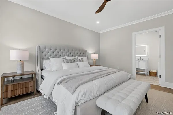 a bedroom with a bed and a couch