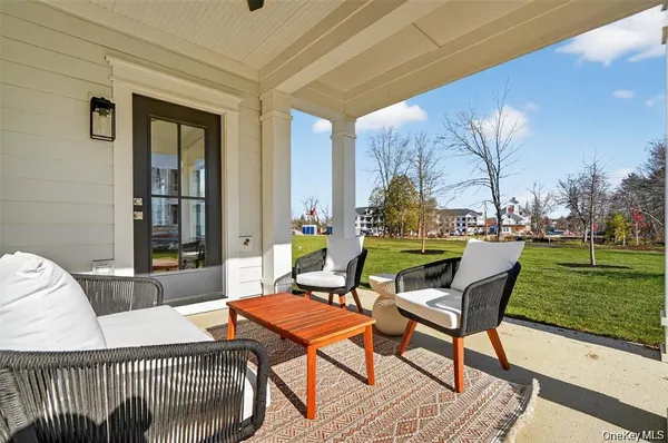 a swimming pool with outdoor seating and yard