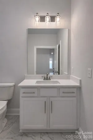a bathroom with a toilet and a bathtub
