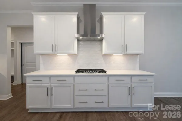 a kitchen with white cabinets