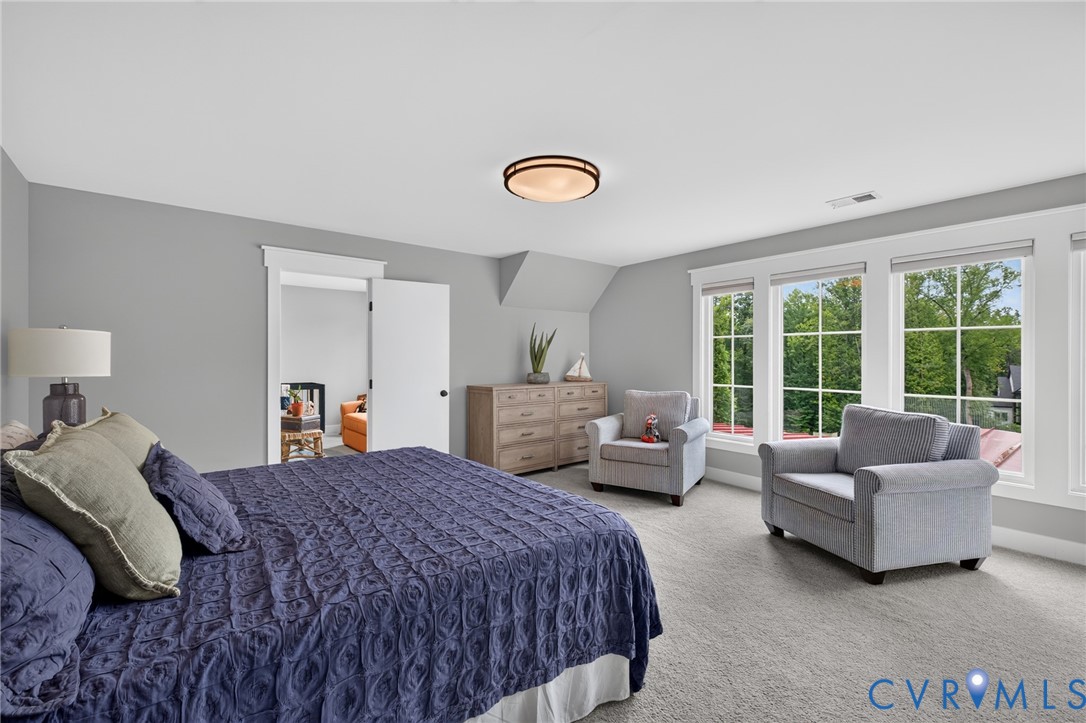 2122 Jockey Ridge Road Maidens, VA 23102 - Photo 37 of 63 a spacious bedroom with a bed and a large window