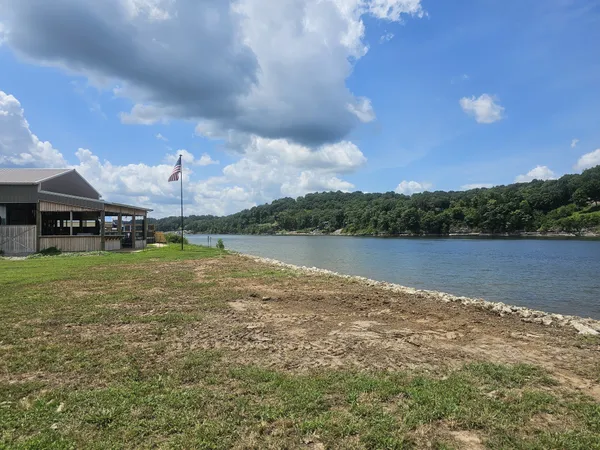 a view of a lake with houses in the back