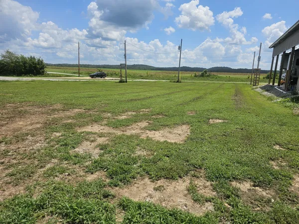 a view of a golf course with a big yard