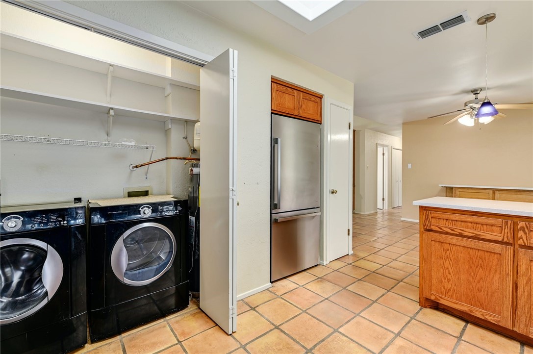 901 Valley View Drive Austin, TX 78733 - Photo 11 of 25 a utility room with sink dryer and washer