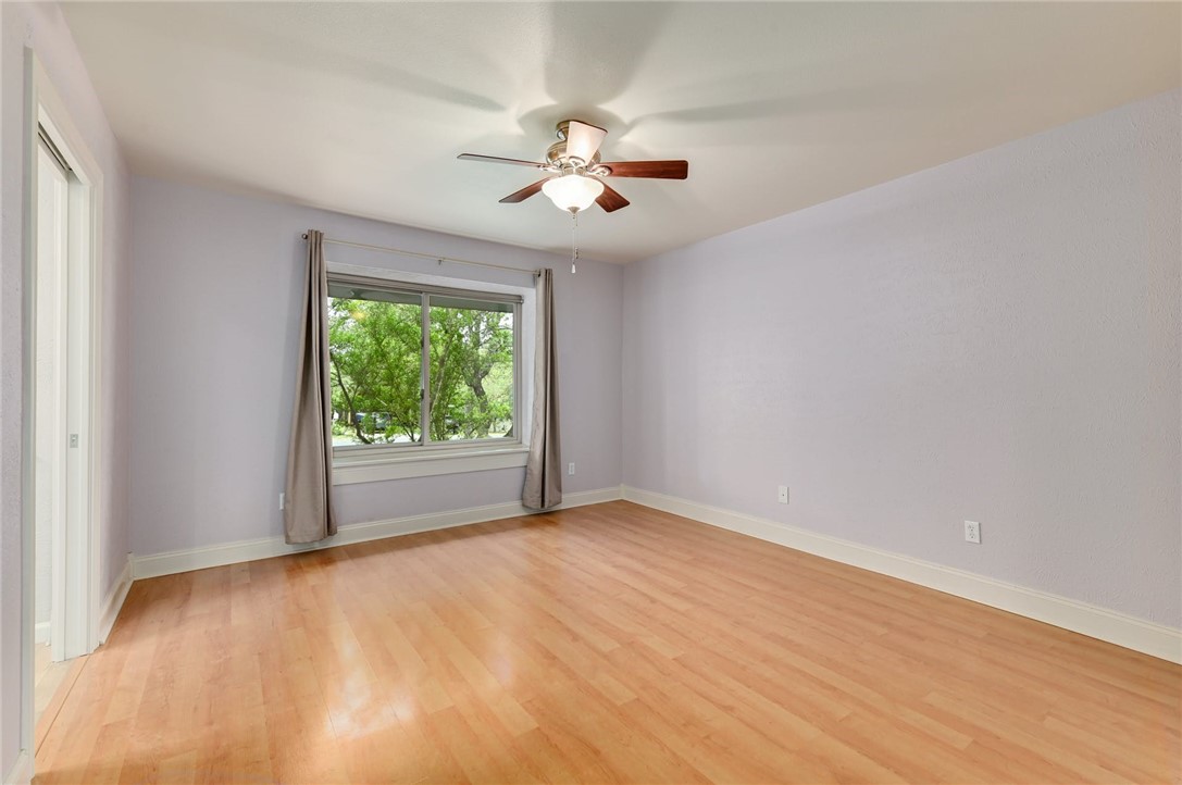 901 Valley View Drive Austin, TX 78733 - Photo 12 of 25 wooden floor in an empty room with a window