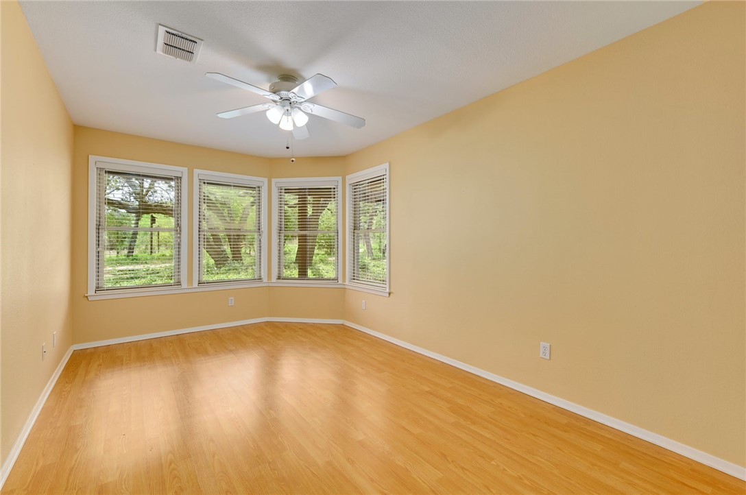 901 Valley View Drive Austin, TX 78733 - Photo 14 of 25 wooden floor in an empty room with a window
