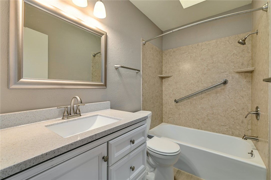 901 Valley View Drive Austin, TX 78733 - Photo 18 of 25 a bathroom with a sink a toilet and shower