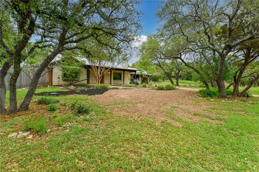 901 Valley View Drive Austin, TX 78733 - Photo 2 of 25 front view of a house with a yard