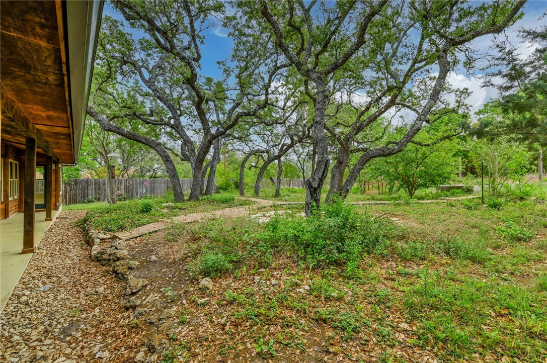 901 Valley View Drive Austin, TX 78733 - Photo 25 of 25 a view of backyard with green space