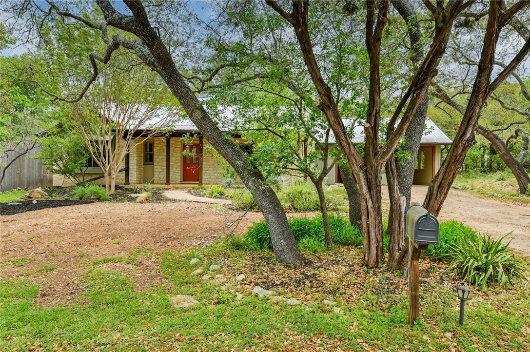 901 Valley View Drive Austin, TX 78733 - Photo 3 of 25 a view of a house with large trees