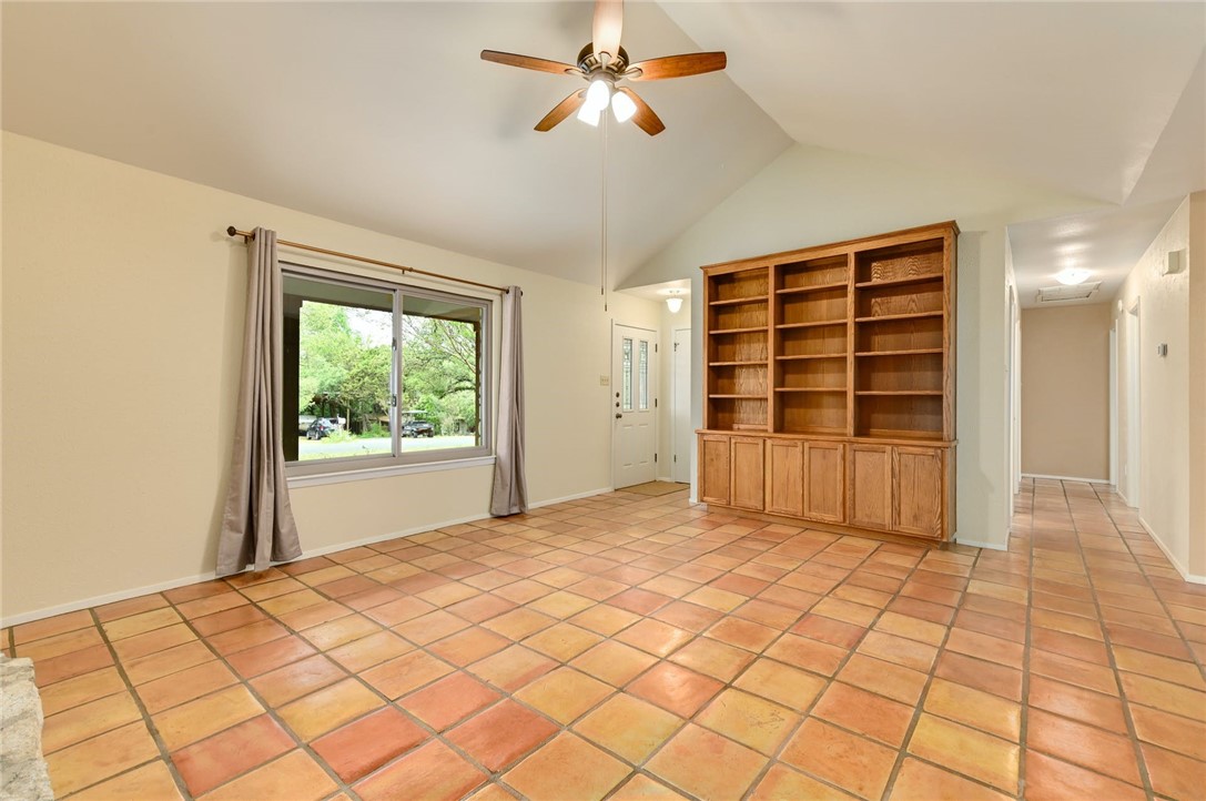 901 Valley View Drive Austin, TX 78733 - Photo 5 of 25 a view of empty room with wooden floor and fan