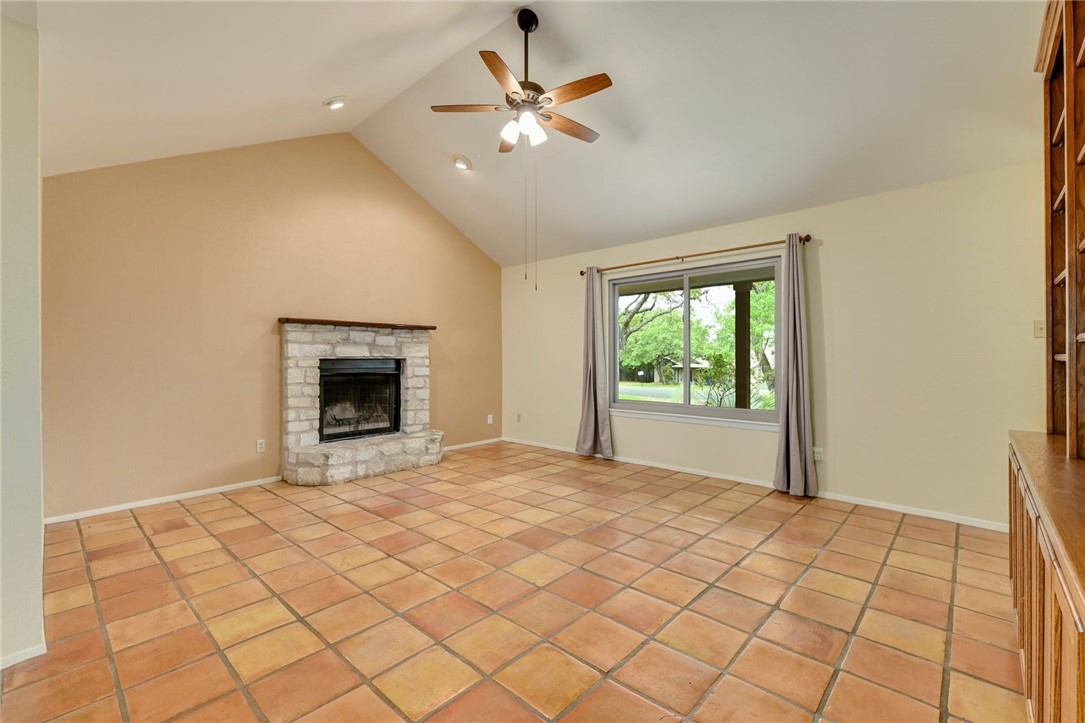 901 Valley View Drive Austin, TX 78733 - Photo 6 of 25 a view of an empty room with a fireplace and a window