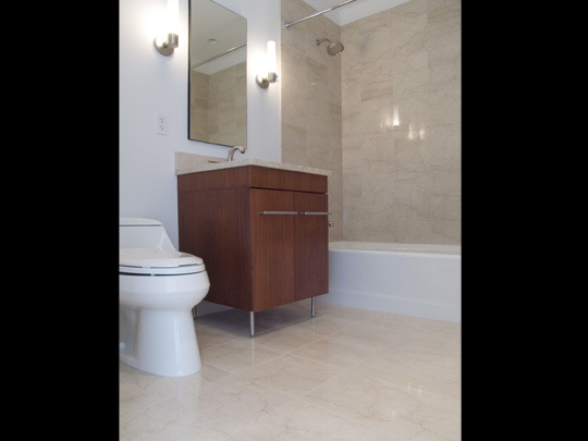 Undisclosed Address Chicago, IL 60611 - Photo 11 of 15 a bathroom with a toilet and a shower