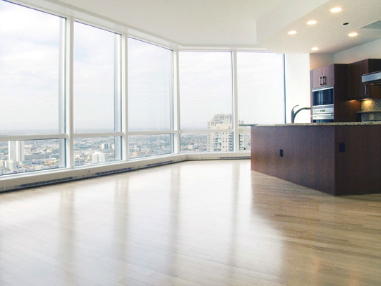 Undisclosed Address Chicago, IL 60611 - Photo 3 of 15 a view of a kitchen with kitchen island large windows and wooden floor