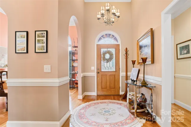 a view of a livingroom with furniture and a front door