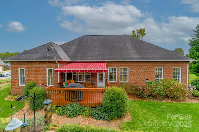 a front view of house with a garden