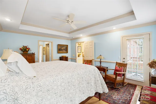 a bedroom with a bed a table and chair