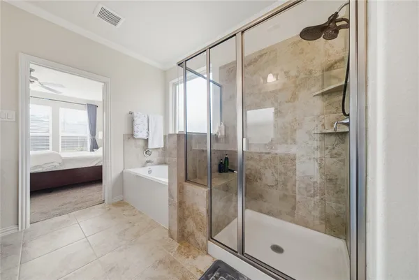a bathroom with a bathtub and a shower