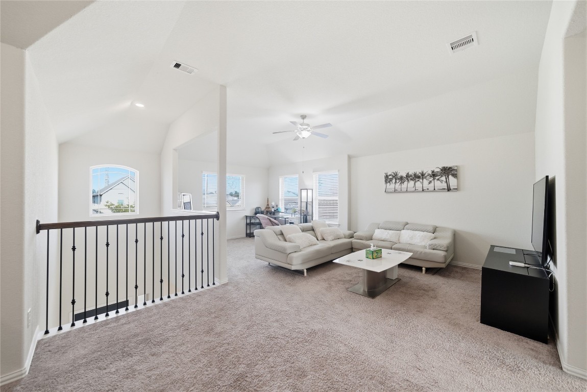 4335 Tawny Timber Drive Spring, TX 77386 - Photo 24 of 42 a living room with furniture and a flat screen tv