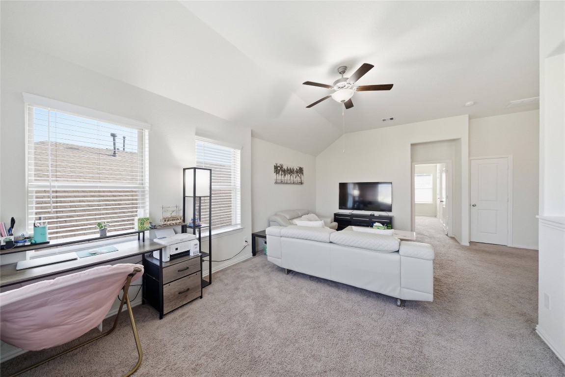 4335 Tawny Timber Drive Spring, TX 77386 - Photo 25 of 42 a living room with furniture and a flat screen tv