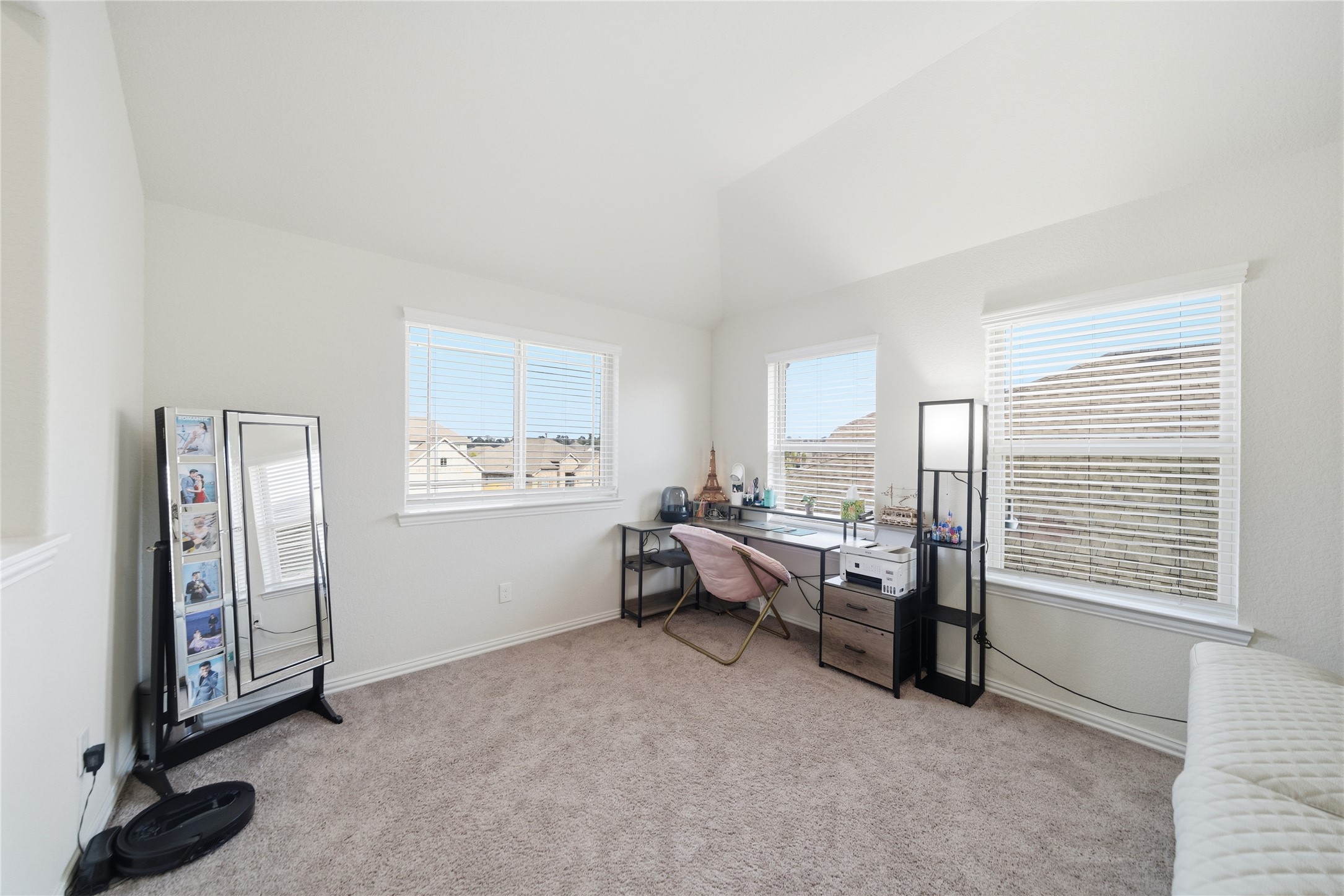 4335 Tawny Timber Drive Spring, TX 77386 - Photo 27 of 42 Bright, cozy room with carpeted flooring, ideal for an office or study space. Features three windows for natural light, a desk, and ample wall space for decor.