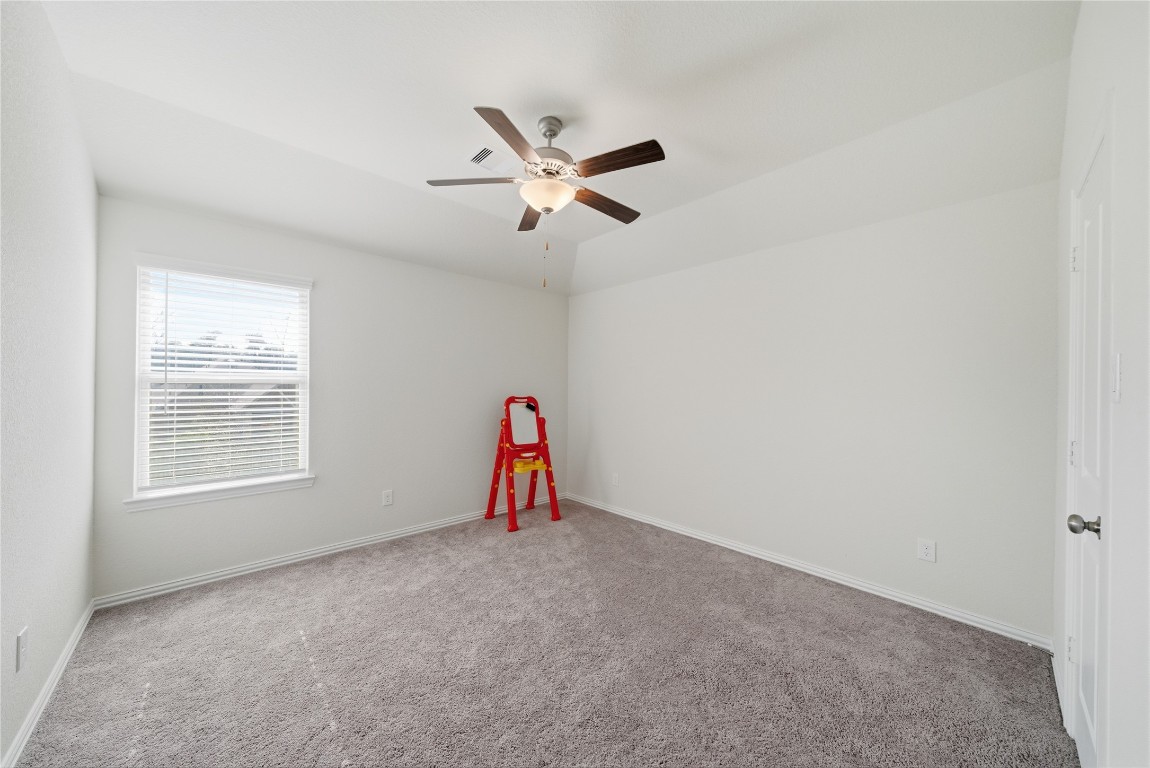 4335 Tawny Timber Drive Spring, TX 77386 - Photo 33 of 42 an empty room with ceiling fan and window