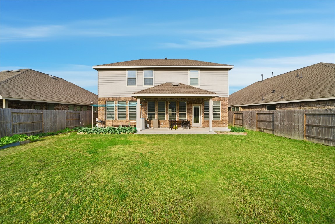 4335 Tawny Timber Drive Spring, TX 77386 - Photo 37 of 42 a front view of a house with a garden