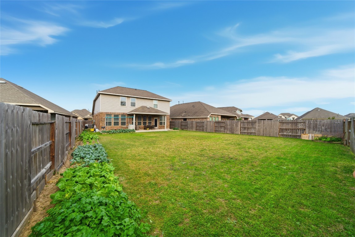 4335 Tawny Timber Drive Spring, TX 77386 - Photo 39 of 42 a view of a house with garden area and a yard