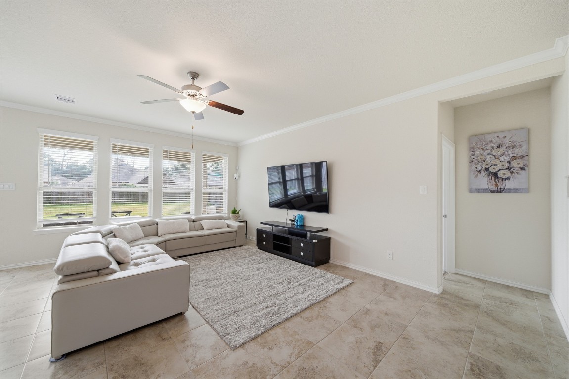 4335 Tawny Timber Drive Spring, TX 77386 - Photo 8 of 42 a living room with furniture and a flat screen tv