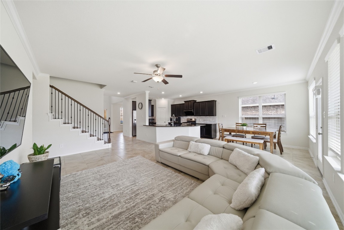 4335 Tawny Timber Drive Spring, TX 77386 - Photo 9 of 42 a living room with furniture and a dining table with kitchen view