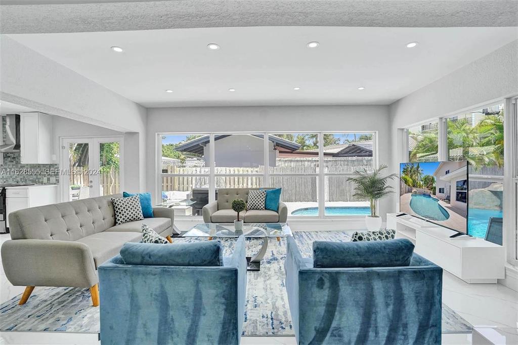 3421 Dover Road Pompano Beach, FL 33062 - Photo 9 of 22 a living room with furniture and a large window